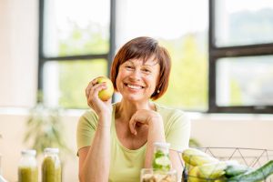 older woman with an apple