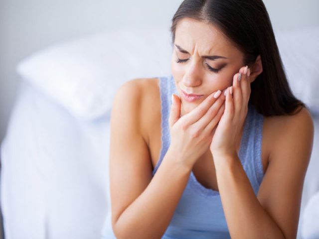 woman with mouth pain