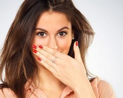 woman covering her mouth