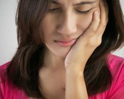woman with mouth pain