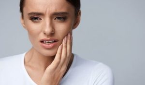 woman with tooth pain